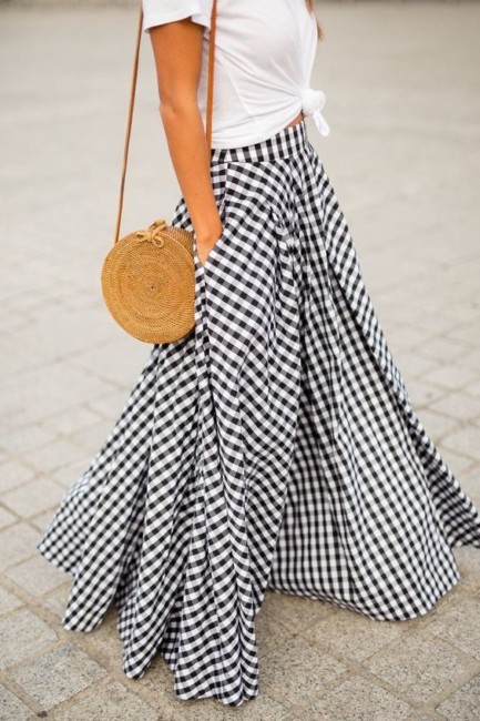 Straw bag and long skirt.